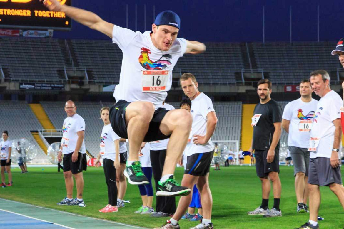 man taking part in olympic long jump activity.